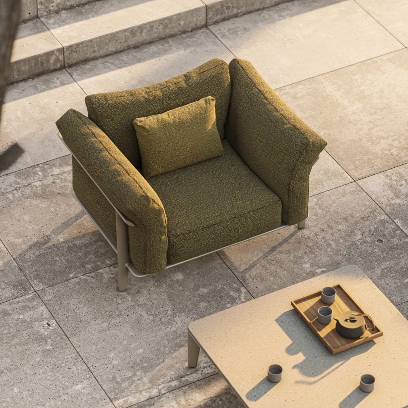 Green couch next to a table